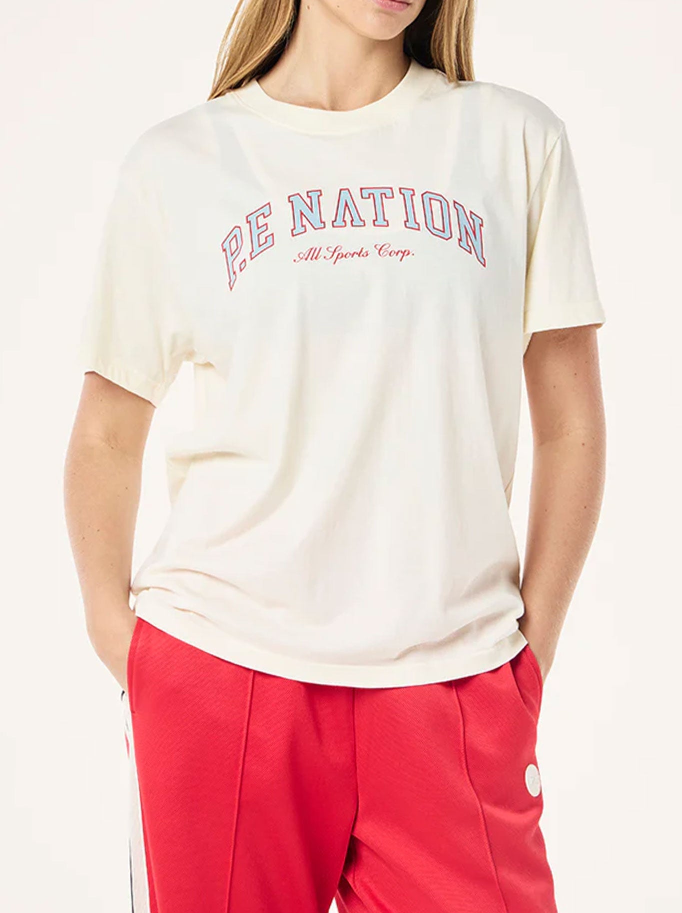 Image of a model wearing Tops. Productname: P.E NATION HERITAGE TEE in Whisper White colour by brand - P.E Nation