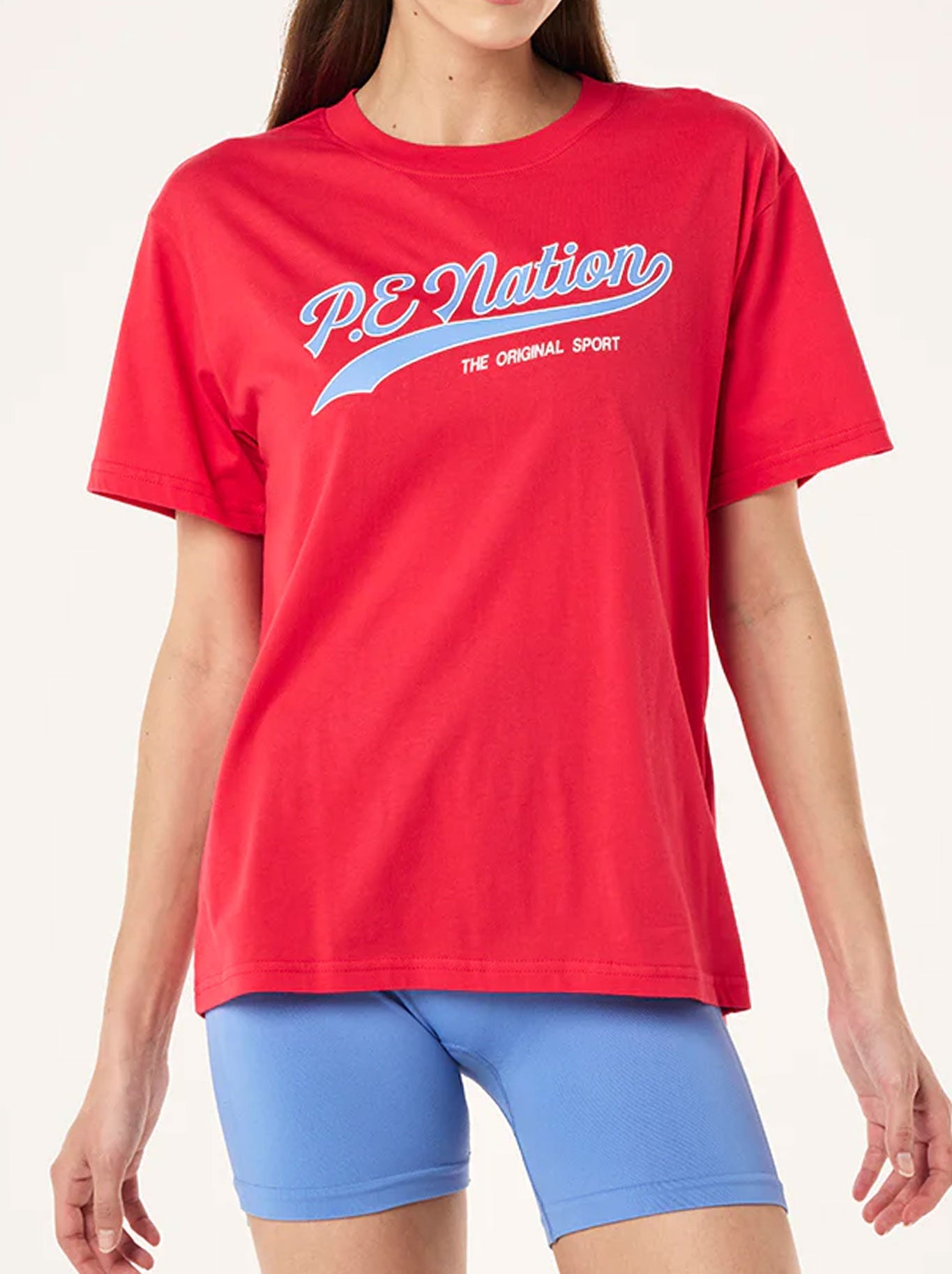Image of a model wearing Tops. Productname: P.E NATION FORMATION TEE in Strawberry colour by brand - P.E Nation
