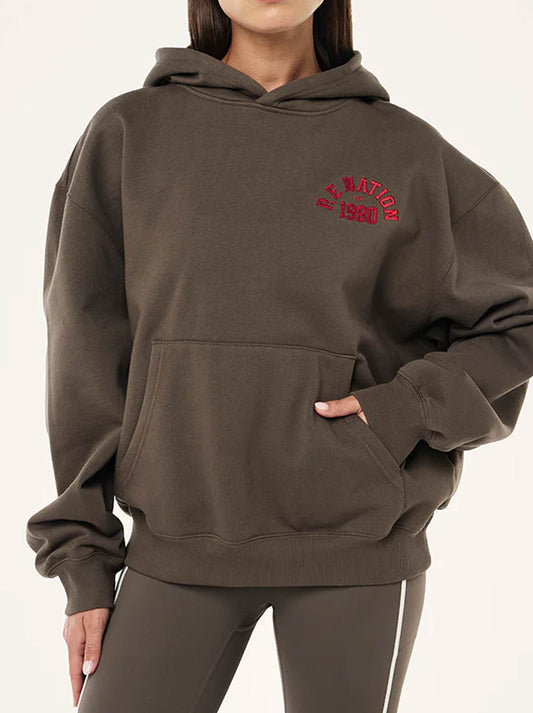 Image of a model wearing Tops. Productname: P.E NATION INBOUND HOODIE in Major Brown colour by brand - P.E Nation