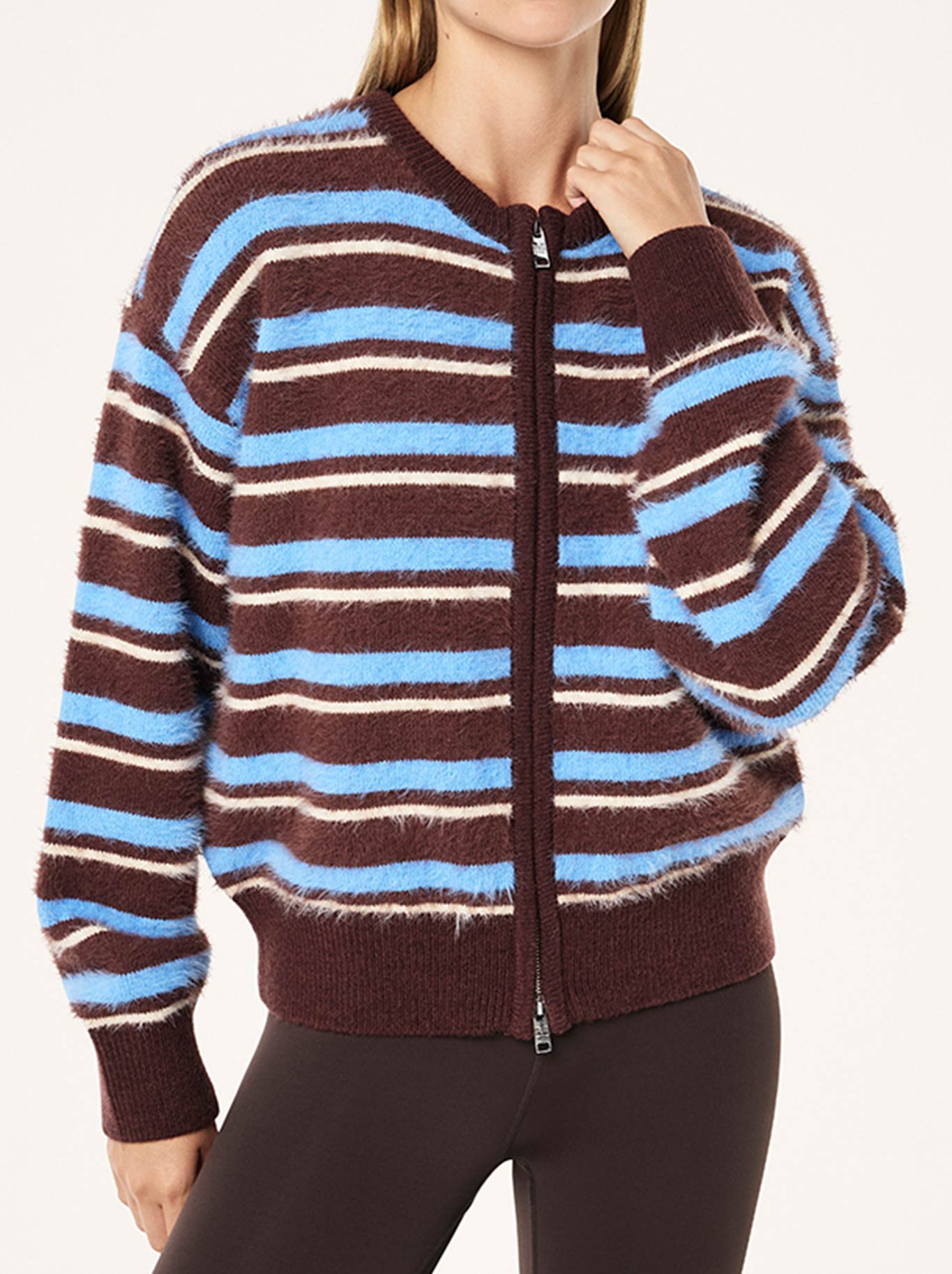 Image of a model wearing Outerwear. Product name - P.E NATION SABLE STRIPE KNIT BOMBER in Coffee Stripe colour by brand - P.E Nation