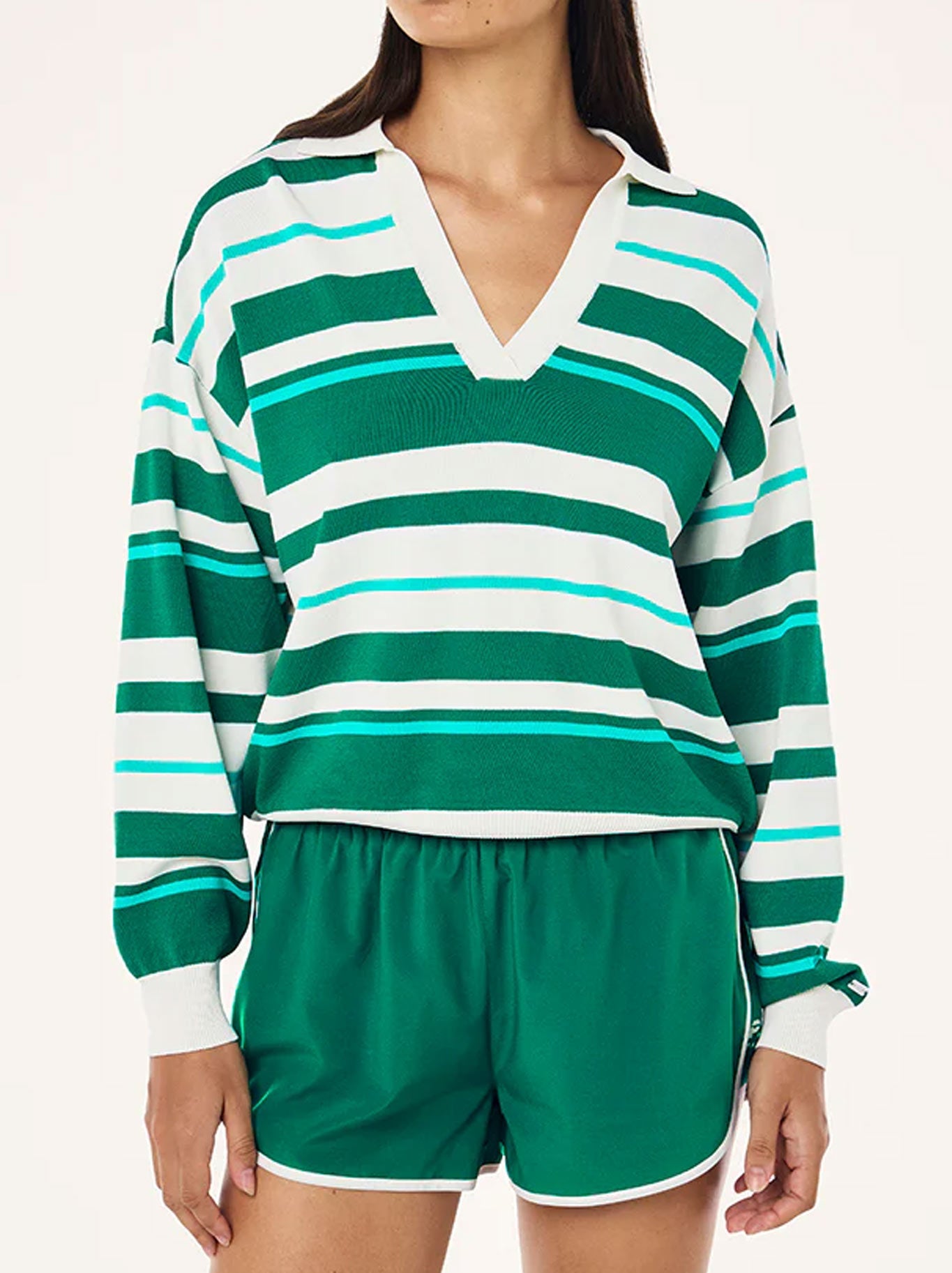 Image of a model wearing Tops. Productname: P.E NATION RETREAT STRIPE COLLAR KNIT in College Green Stripe colour by brand - P.E Nation