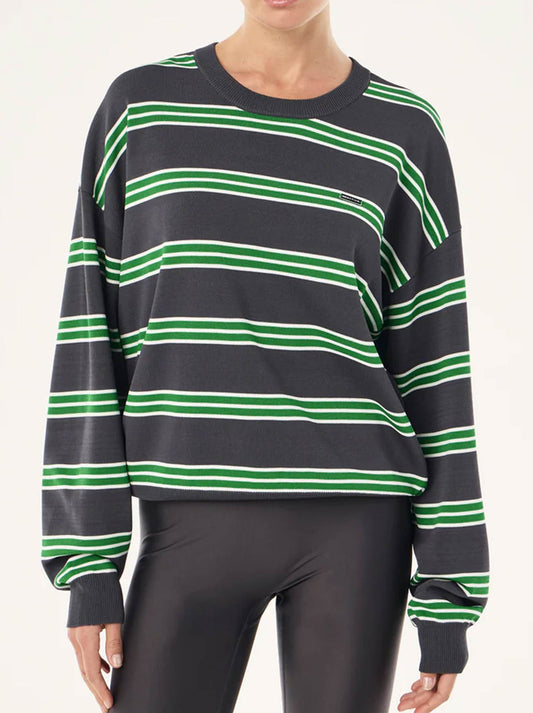 Image of a model wearing Outerwear. Product name - P.E NATION RETREAT STRIPE SWEATER in Iron Stripe colour by brand - P.E Nation
