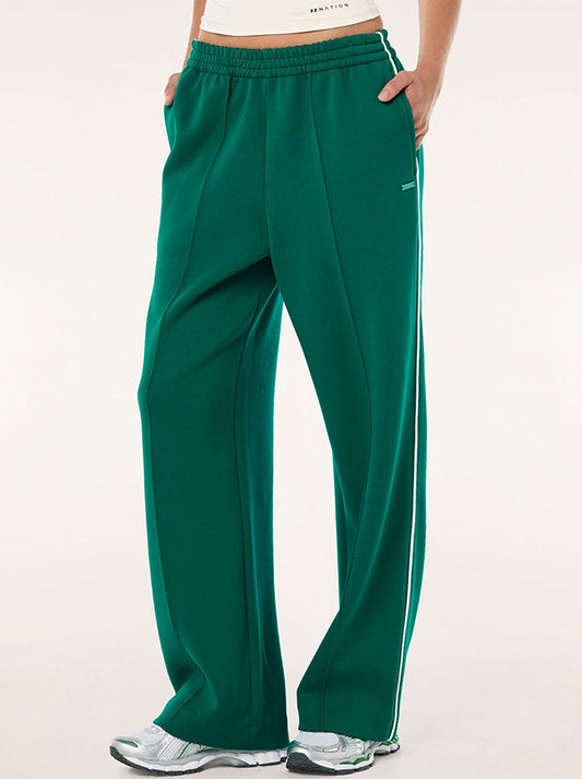 Image of a model wearing Pants. Productname: P.E NATION TRIUMPH PANT in College Green colour by brand - P.E Nation