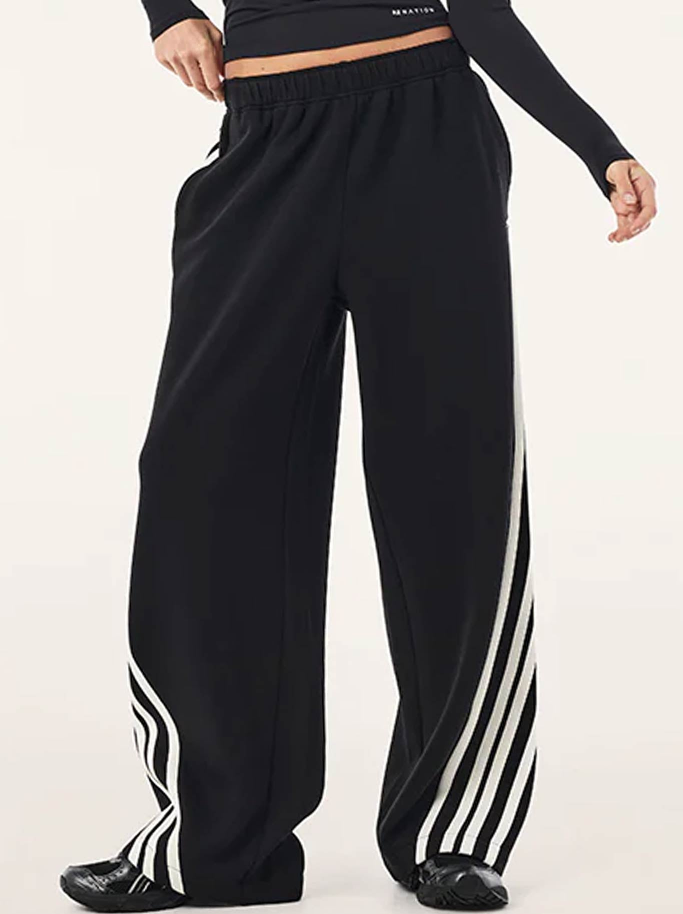Image of a model wearing Pants. Product name - P.E NATION VOLTAGE PANT in Black colour by brand - P.E Nation