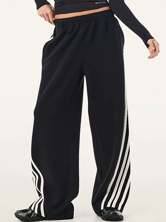Image of a model wearing Pants. Product name - P.E NATION VOLTAGE PANT in Black colour by brand - P.E Nation