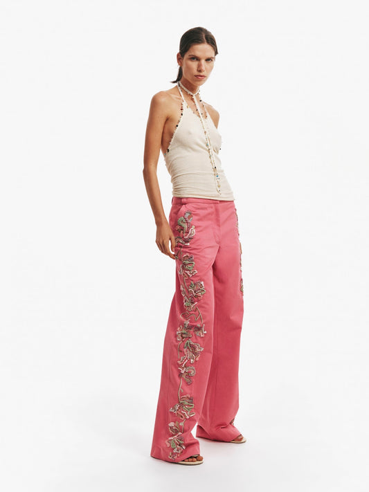 Image of a model wearing Pants. Productname: Christopher Esber Duke Embellished Chino Pant in Pink colour by brand - Christopher Esber