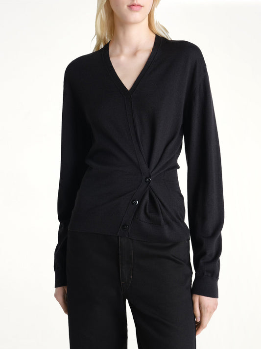 Image of a model wearing Outerwear. Product name - Twisted V Neck Jumper in Black colour by brand - LEMAIRE