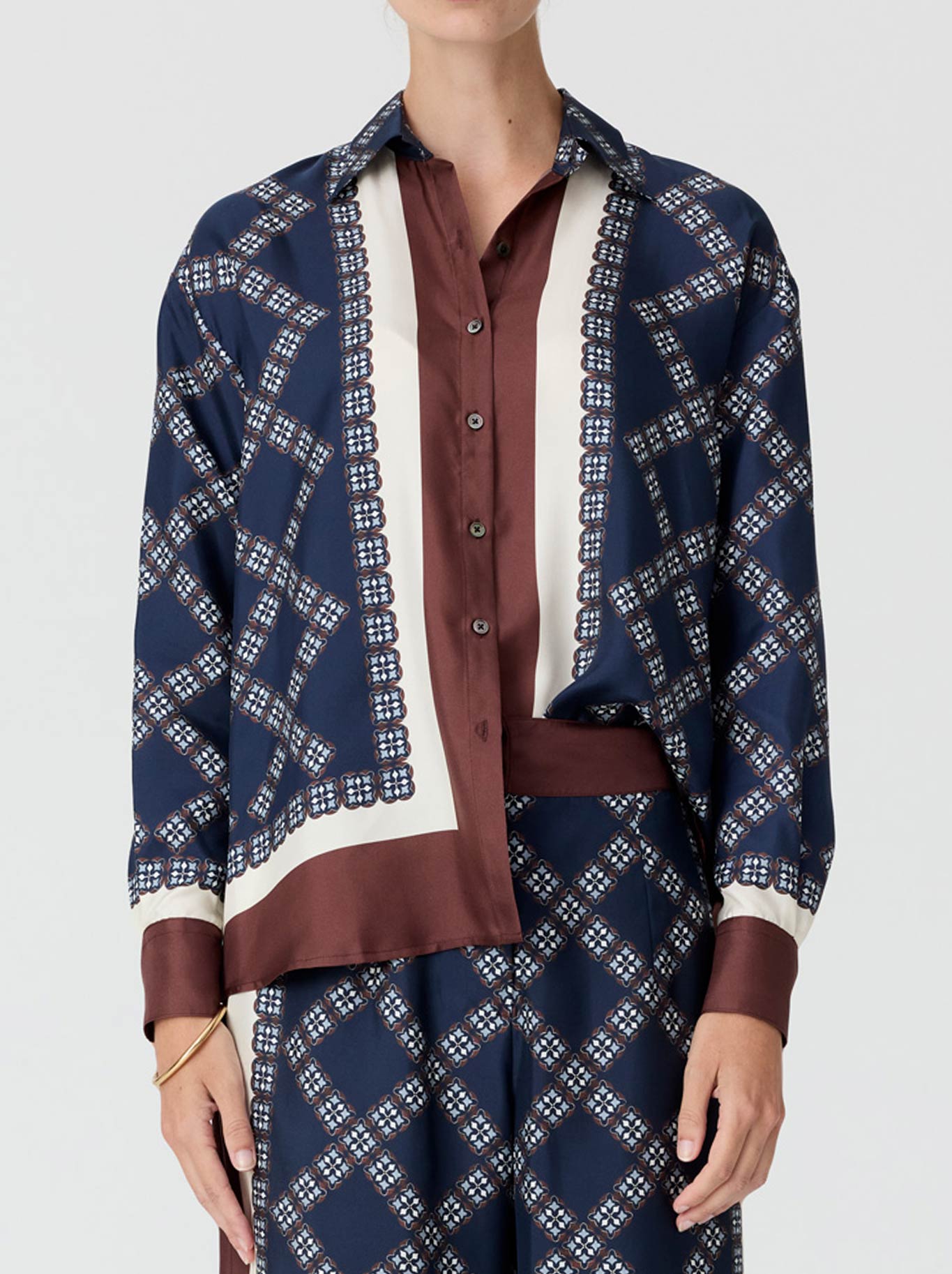 Image of a model wearing Tops. Product name - Pol Eden Silk Shirt in Eden colour by brand - Pol