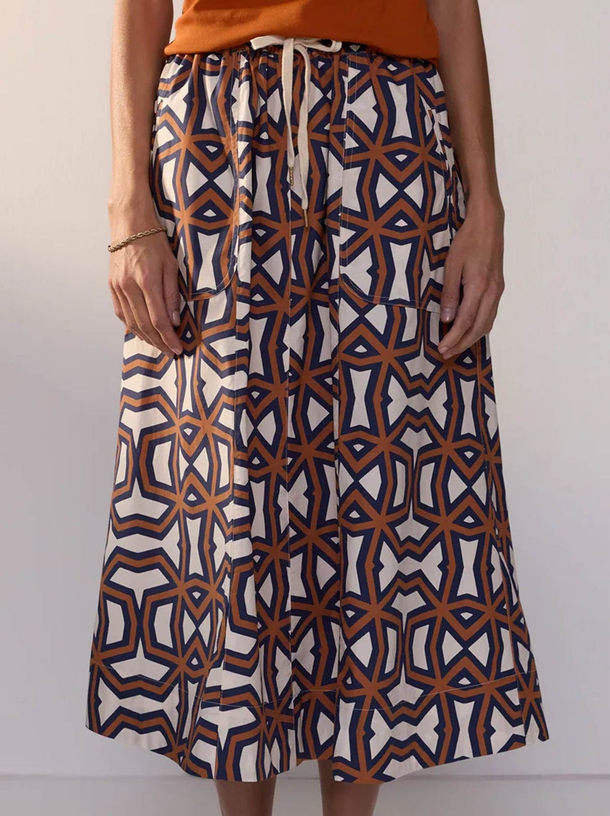 Image of a model wearing Skirts. Product name - POL HALI SKIRT in Hali Print colour by brand - Pol