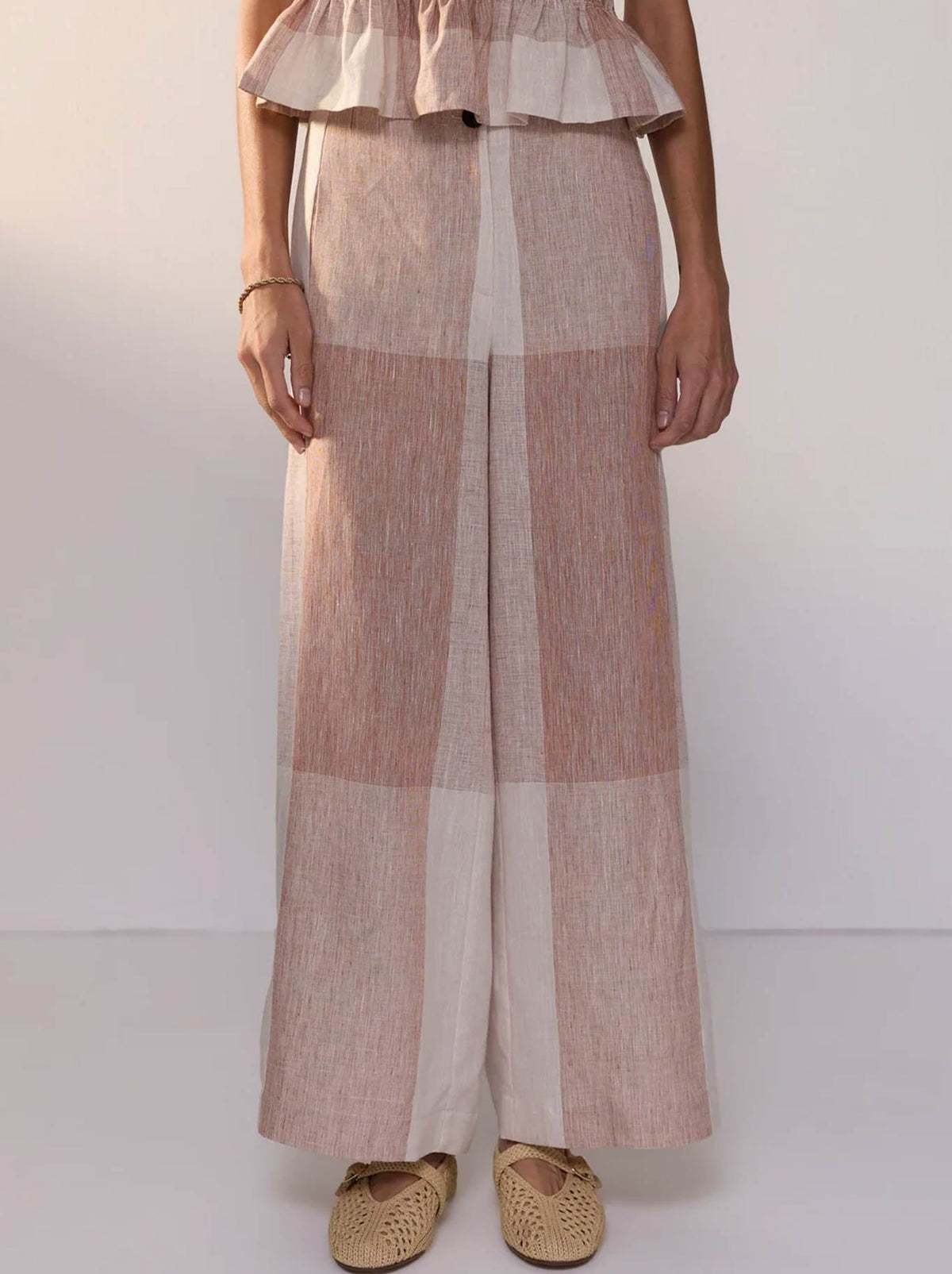 Image of a model wearing Pants. Product name - POL NIXIE PANT in Toffee Gingham colour by brand - Pol