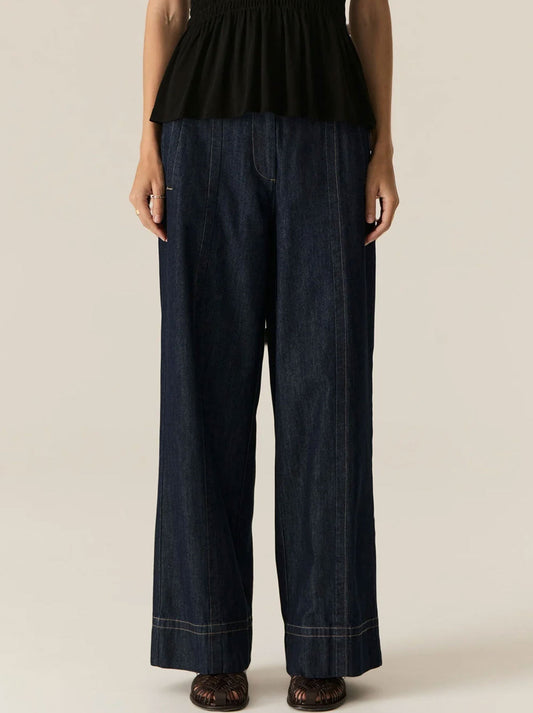 Image of a model wearing Pants. Productname: POL CARSEN FULL LENGTH DENIM PANT in Dark Denim colour by brand - Pol