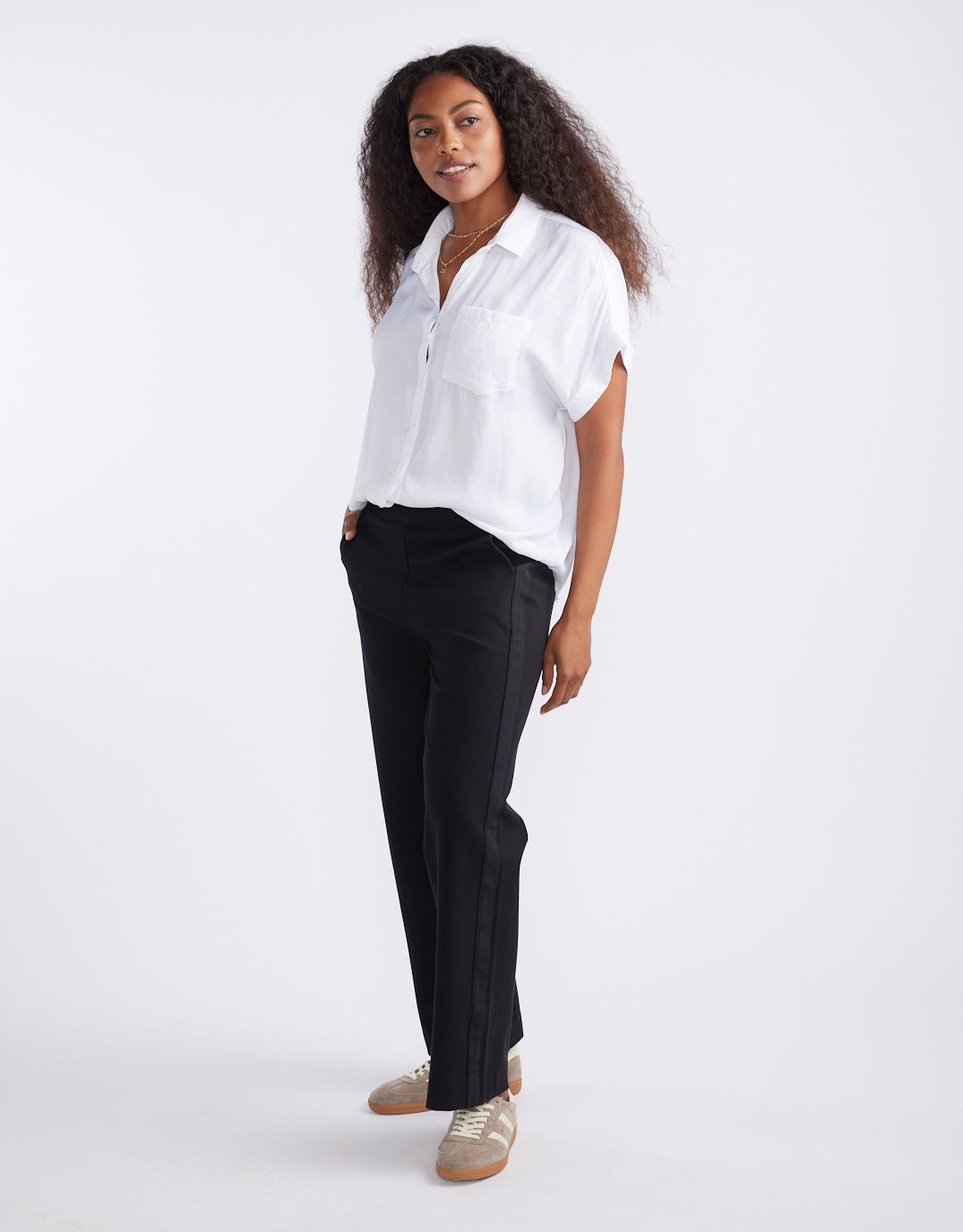Image of a model wearing Pants. Productname: Timeless Straight Leg Ponte Pant - in Black On Black colour by brand - White & Co.