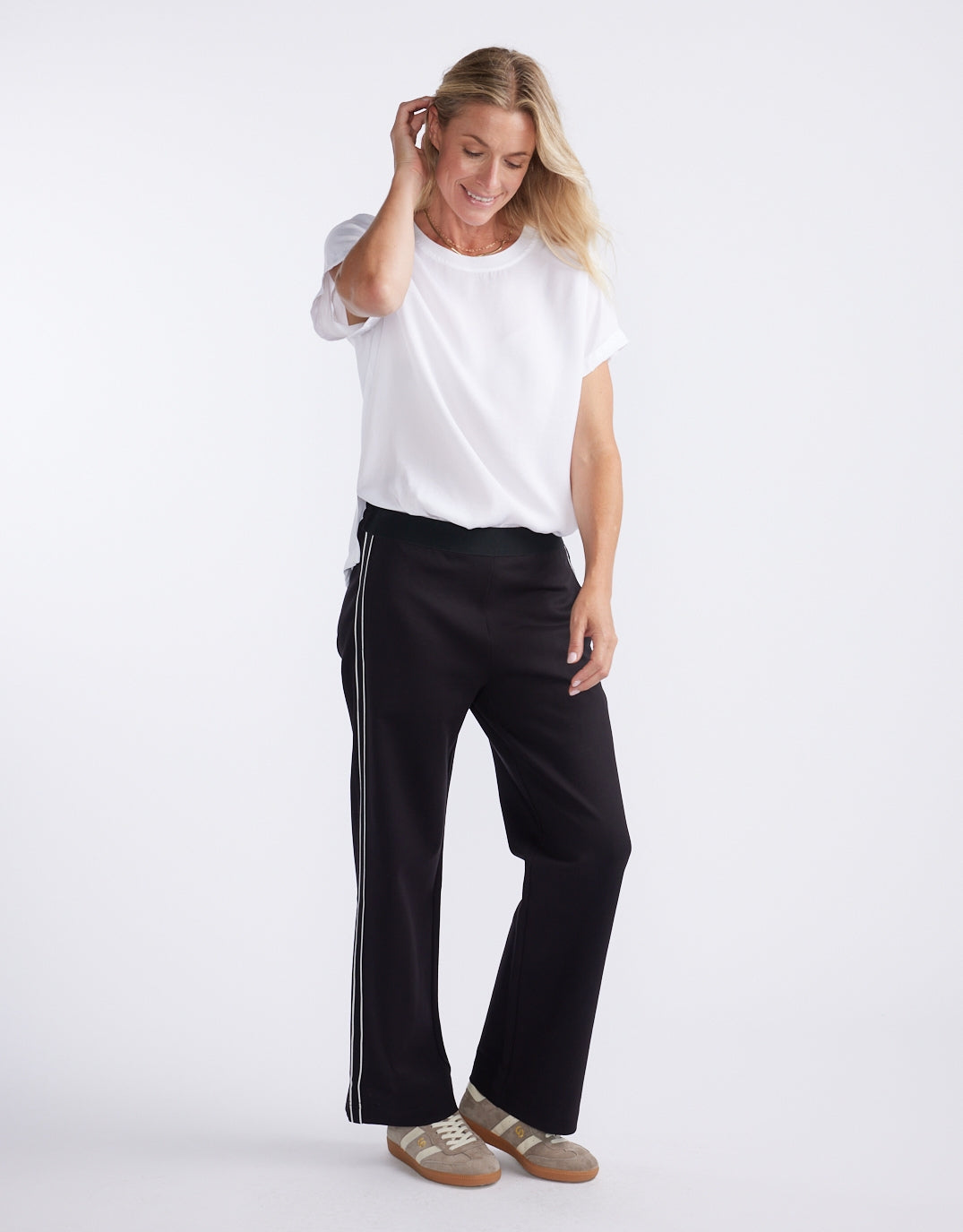 Image of a model wearing Pants. Productname: Timeless Straight Leg Ponte Pant - in French Tape colour by brand - White & Co.