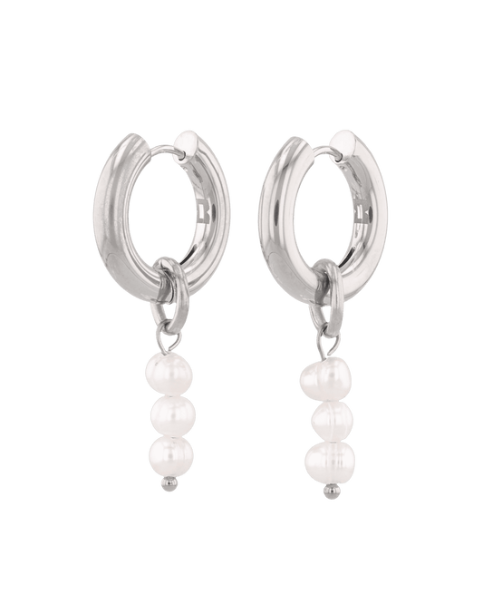 Image of Earrings. Product name - Pebble Pearl Charm Silver Huggie Earrings in colour by brand - LAVANA