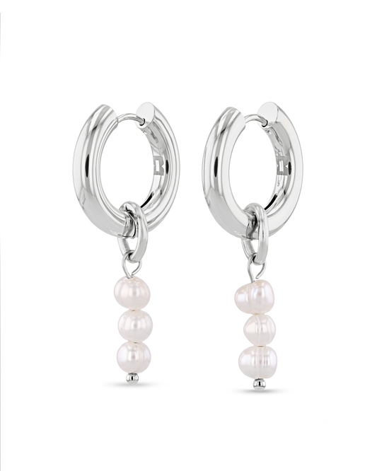 Image of Earrings. Product name - Pebble Pearl Charm Silver Huggie Earrings in colour by brand - LAVANA
