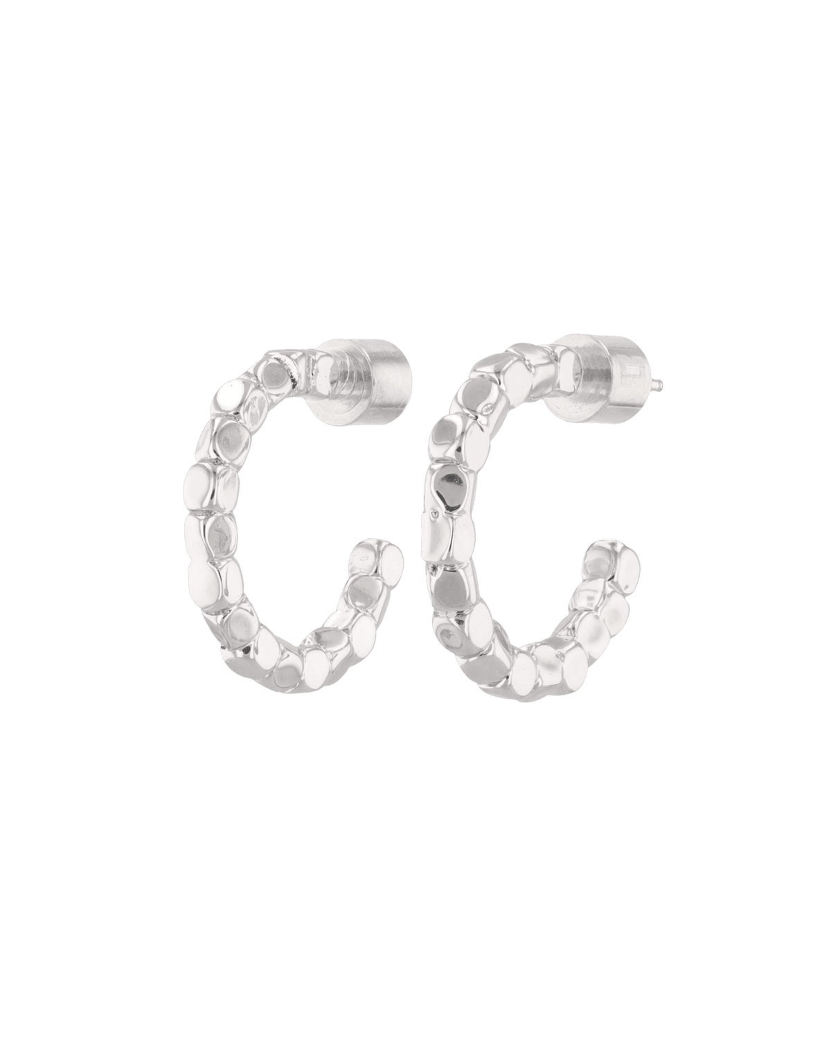 Image of Earrings. Product name - Pebble Textured Silver Hoop Earrings in colour by brand - LAVANA