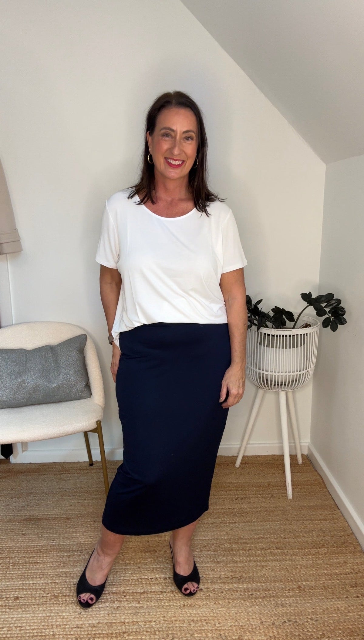 Image of a model wearing Tops. Product name - Janis Short Sleeve Bamboo T-Shirt White in White colour by brand - Lou Lou
