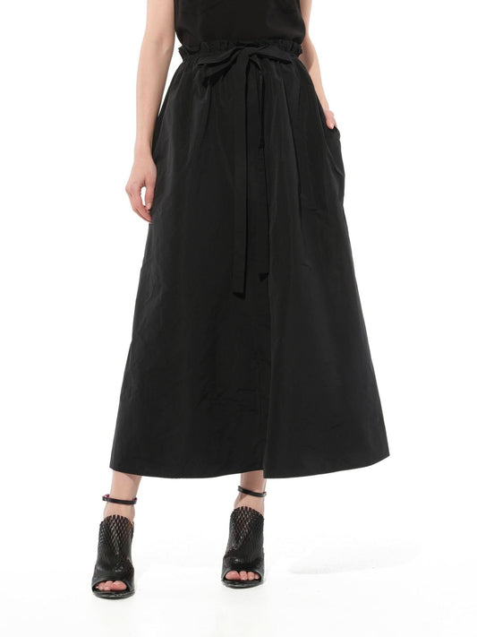 Image of a model wearing Skirts. Productname: GIVENCHY Podium L62 Slited Skirt in Black colour by brand - GIVENCHY
