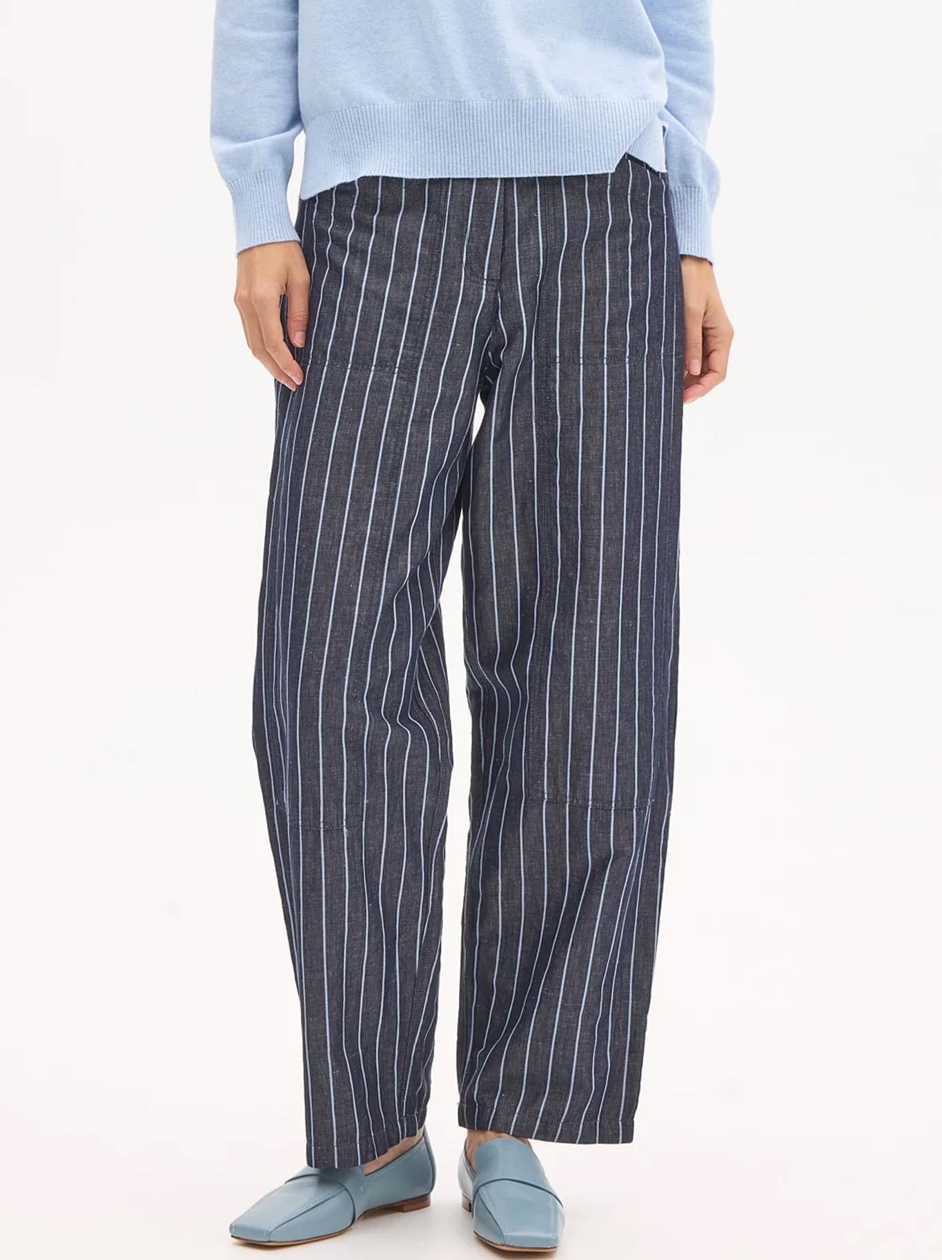 Image of a model wearing Pants. Product name - POL PINSTRIPE MUHLE PANT in Indigo colour by brand - Pol