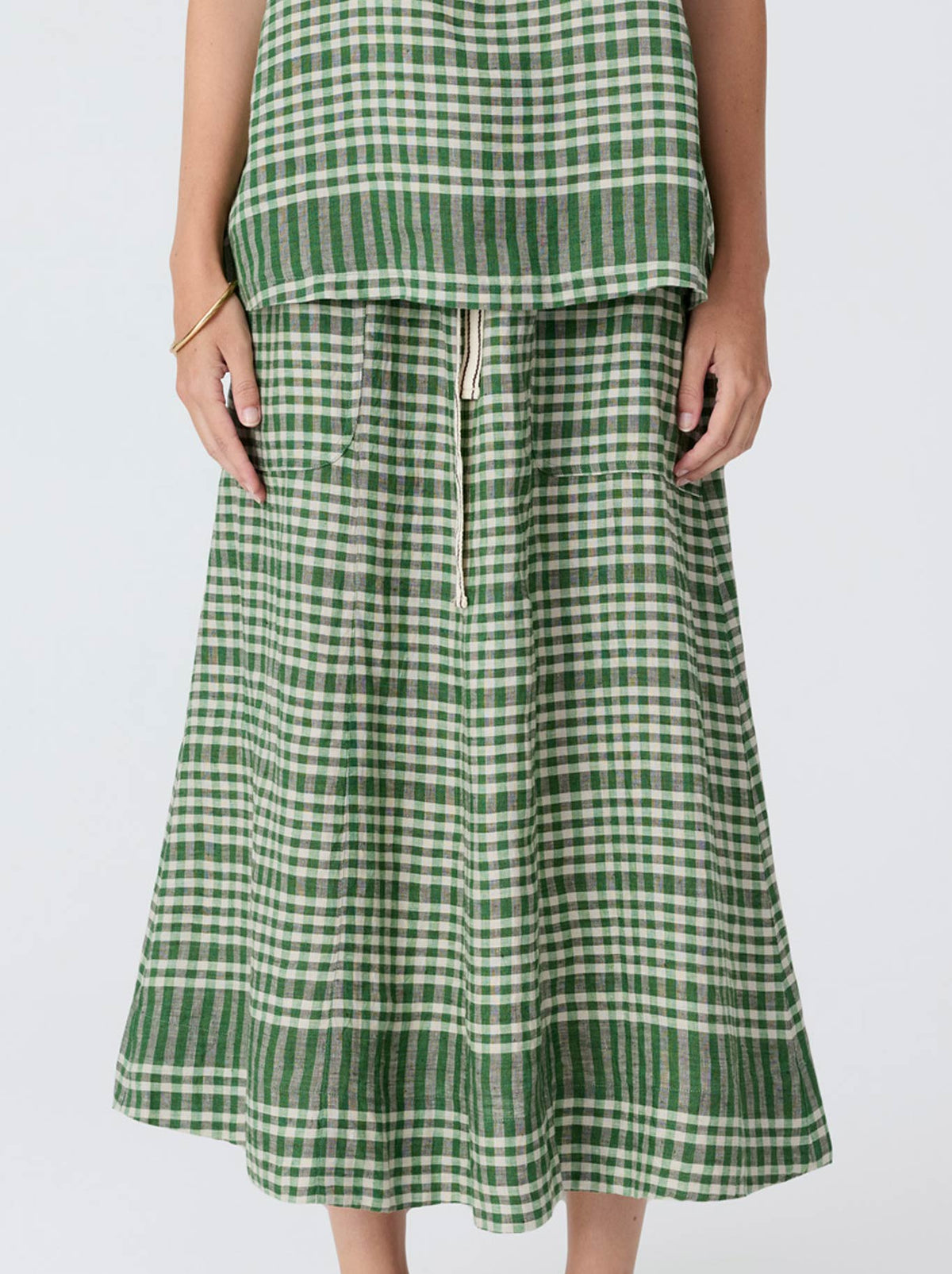 Image of a model wearing Skirts. Product name - Pol Lume Skirt in Gingham colour by brand - Pol