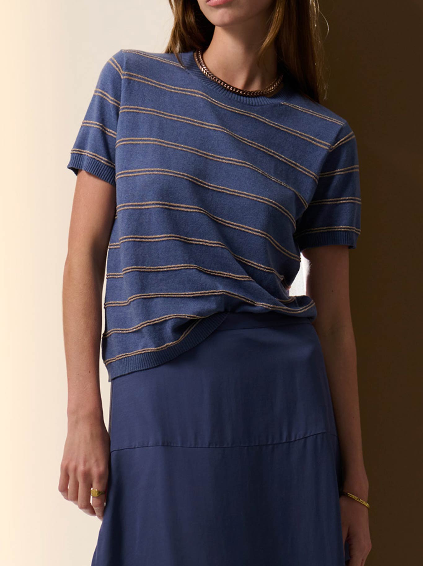 Image of a model wearing Tops. Product name - POL SABLE LUREX STRIPE TEE in Blue Gold colour by brand - Pol