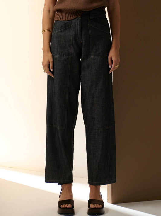 Image of a model wearing Pants. Productname: POL MUHLE DENIM BARREL PANT in Black colour by brand - Pol