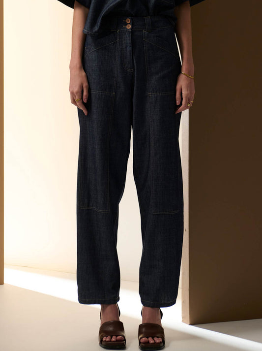 Image of a model wearing Pants. Product name - POL MUHLE DENIM PANT in Indigo colour by brand - Pol