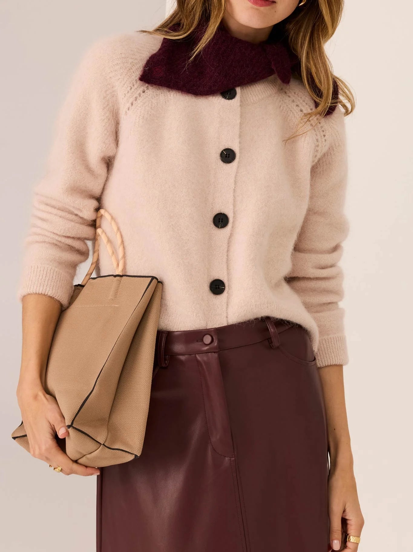 Image of a model wearing Outerwear. Product name - POL HAVILAND CARDI in Blush colour by brand - Pol