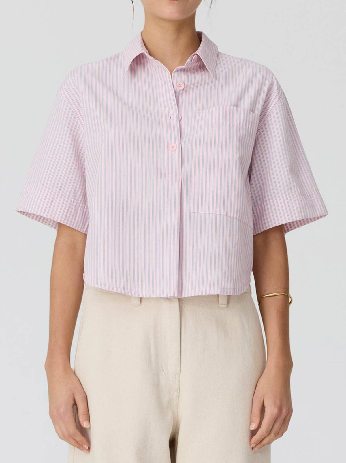 Image of a model wearing Tops. Product name - POL AUBIN CAMP SHIRT in Pink Stripe colour by brand - Pol