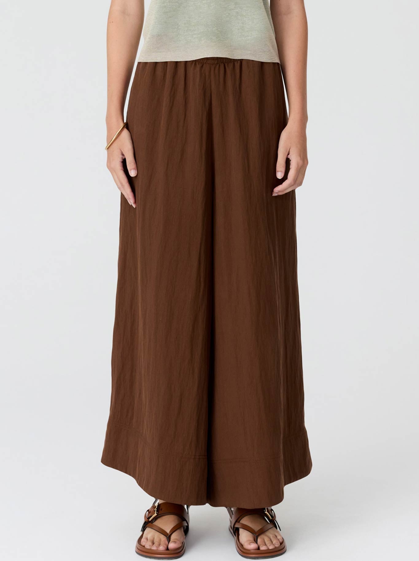Image of a model wearing Pants. Product name - Pol Aster Pant in Chocolate colour by brand - Pol