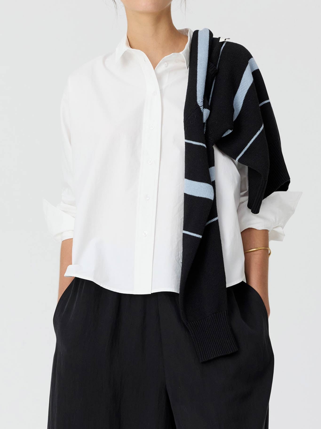 Image of a model wearing Tops. Product name - POL ELINA 2 WAY SHIRT in White colour by brand - Pol