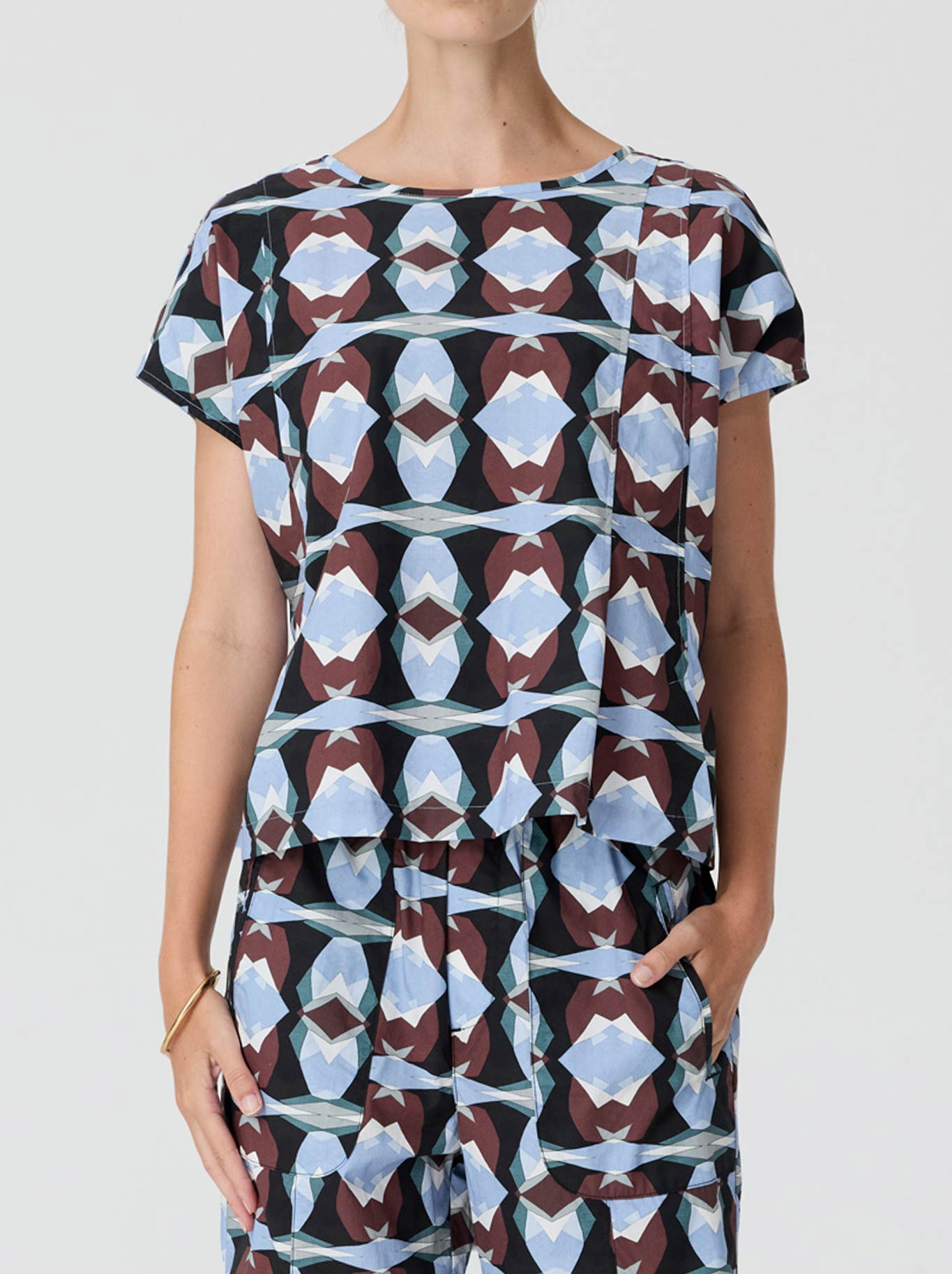 Image of a model wearing Tops. Product name - Pol Thyra Reversible Tee in Thyra Print colour by brand - Pol