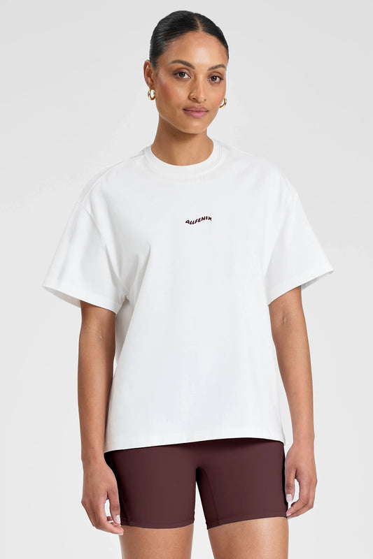 Image of T-Shirts. Product name - ALLFENIX Probably at Pilates Tee White/Espresso in White colour by brand - All Fenix