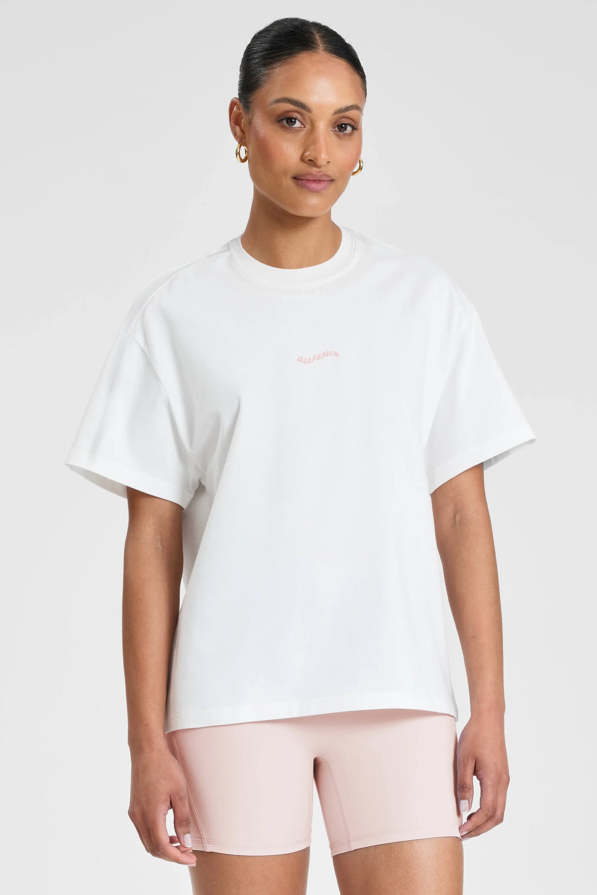 Image of T-Shirts. Product name - ALLFENIX Probably at Pilates Tee White/Pink in White colour by brand - All Fenix