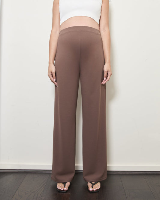 Image of a model wearing Pants. Product name - Pull-On Wide Leg Pants in Long colour by brand - Soon Maternity