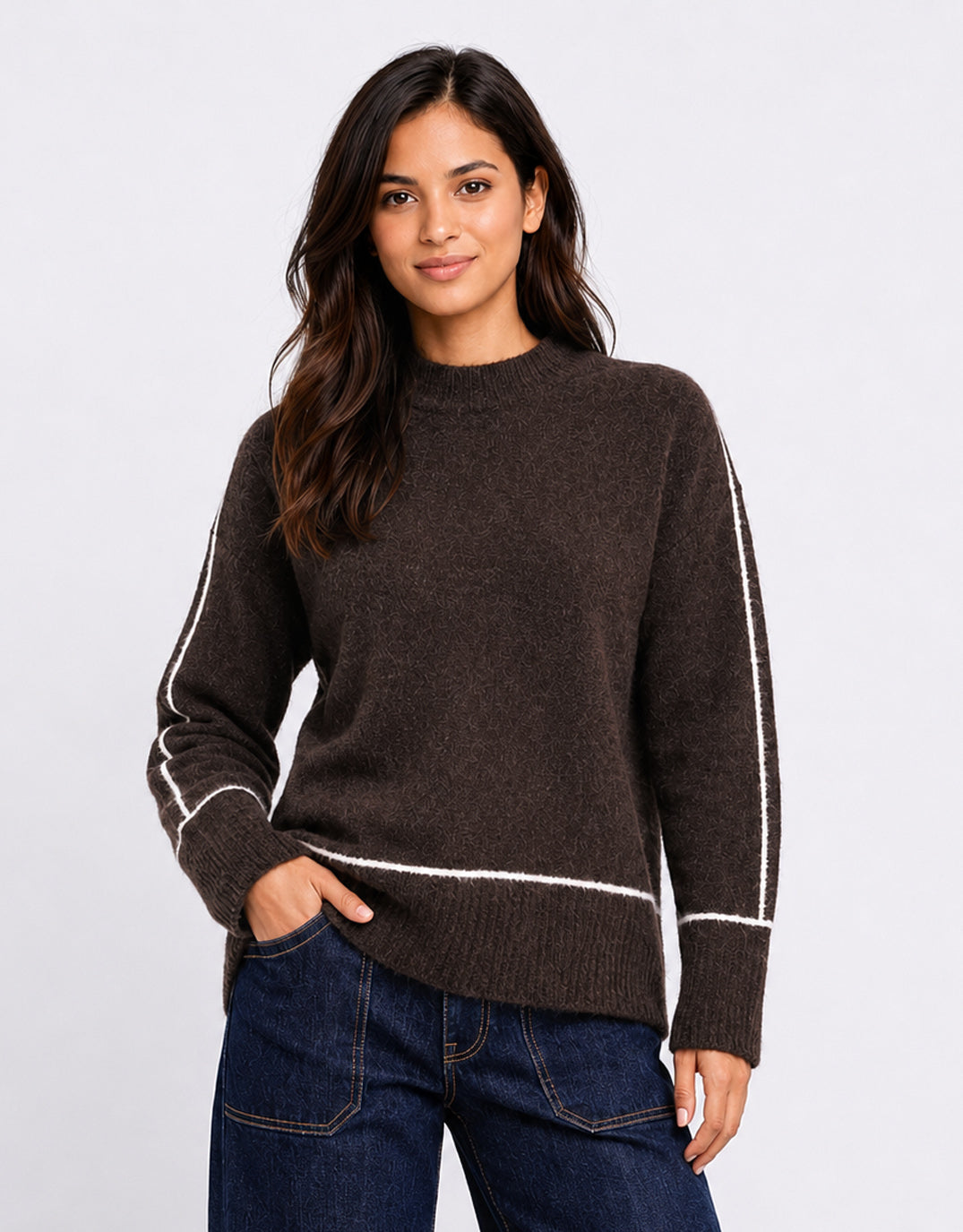 Image of a model wearing Outerwear. Product name - Quest Contrast Detail Jumper Chocolate in Chocolate colour by brand - Stories Be Told