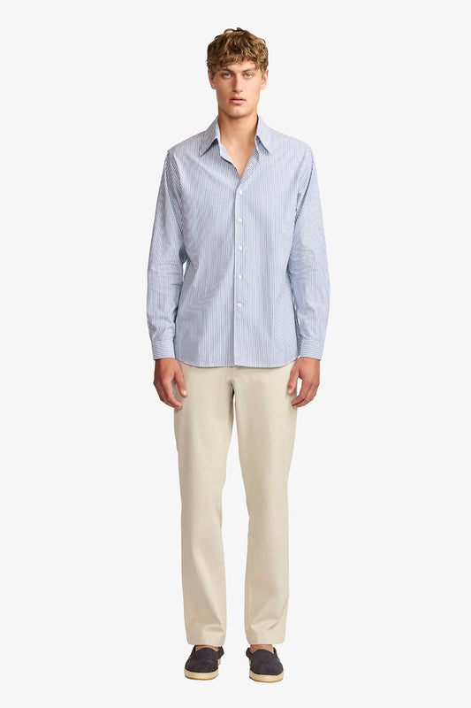 Image of a model wearing Pants. Product name - Austin + Stone Chino in Stone colour by brand - Anthony Squires