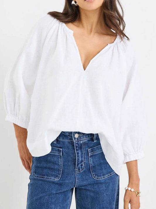 Image of a model wearing Tops. Productname: RE:UNION THE LABEL REVOLUTIONARY LINEN TOP in White colour by brand - Re:Union The Label