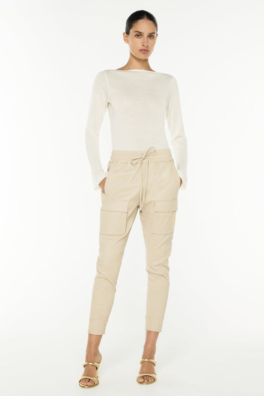 Image of a model wearing Pants. Productname: Open Season Stretch Leather Pant in ALMOND colour by brand - Manning Cartell