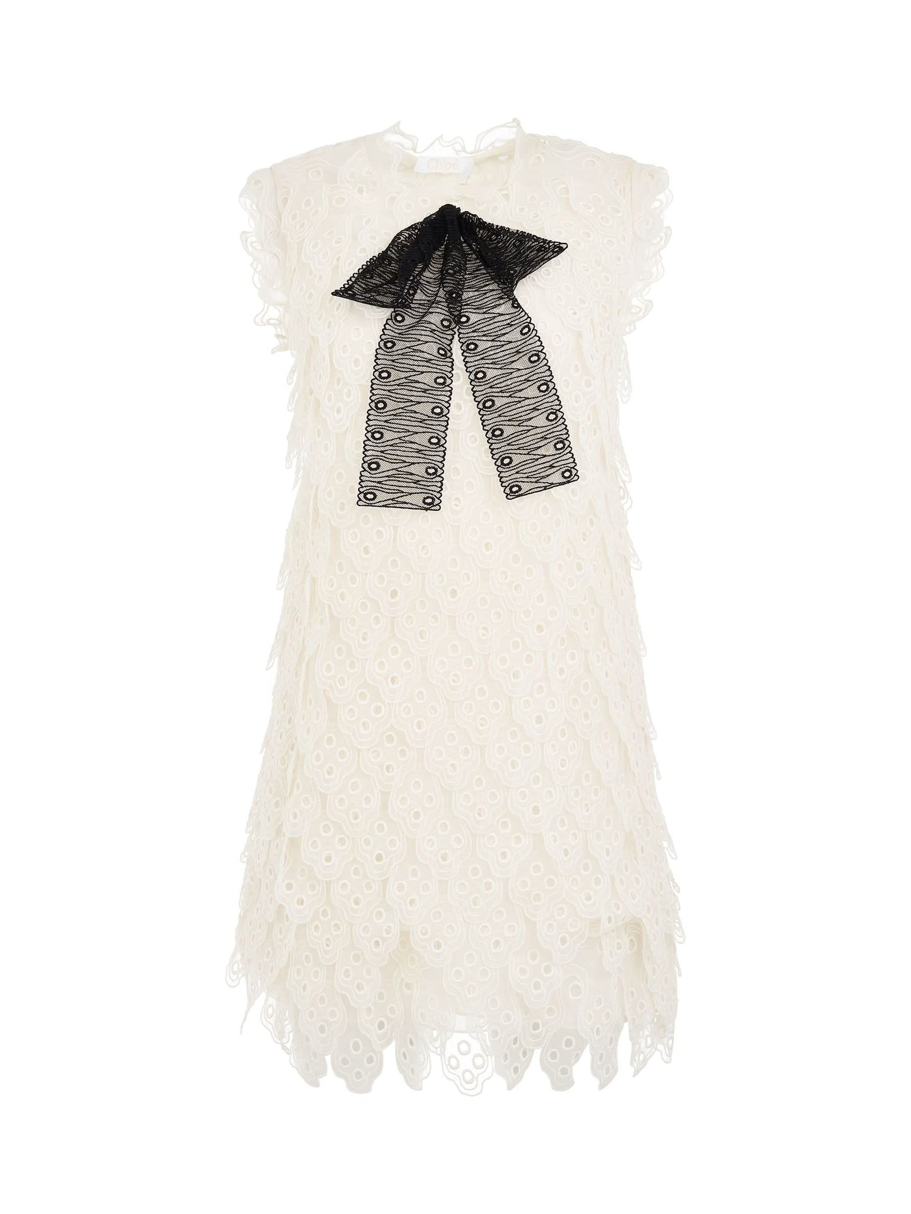 Image of a model wearing Dress. Productname: CHLOE Dress in White with Black Bow colour by brand - CHLOE