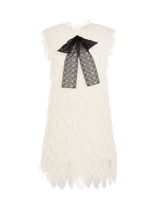 Image of a model wearing Dress. Productname: CHLOE Dress in White with Black Bow colour by brand - CHLOE