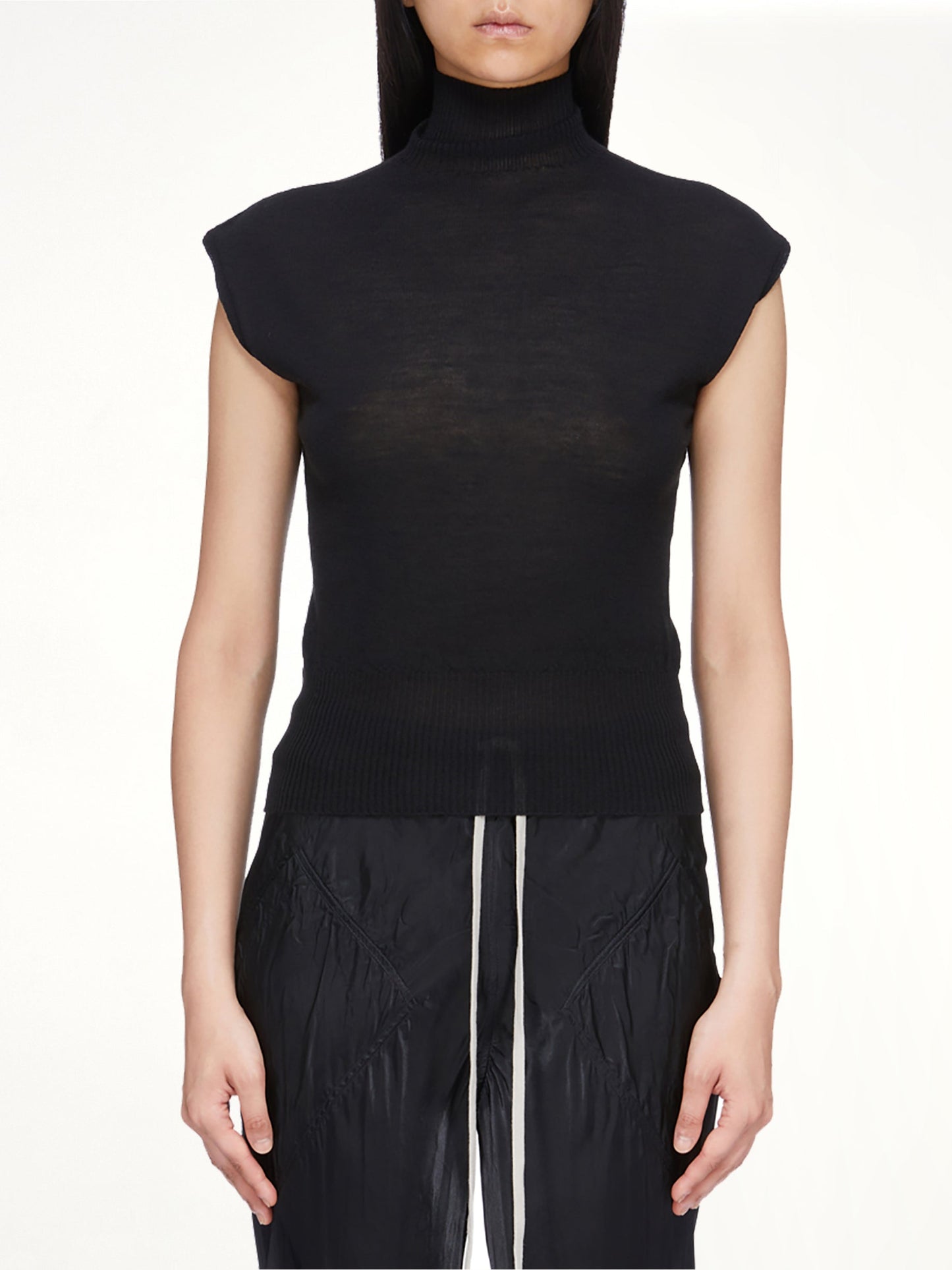 Image of a model wearing Tops. Product name - SL Turtle in Black colour by brand - RICK OWENS