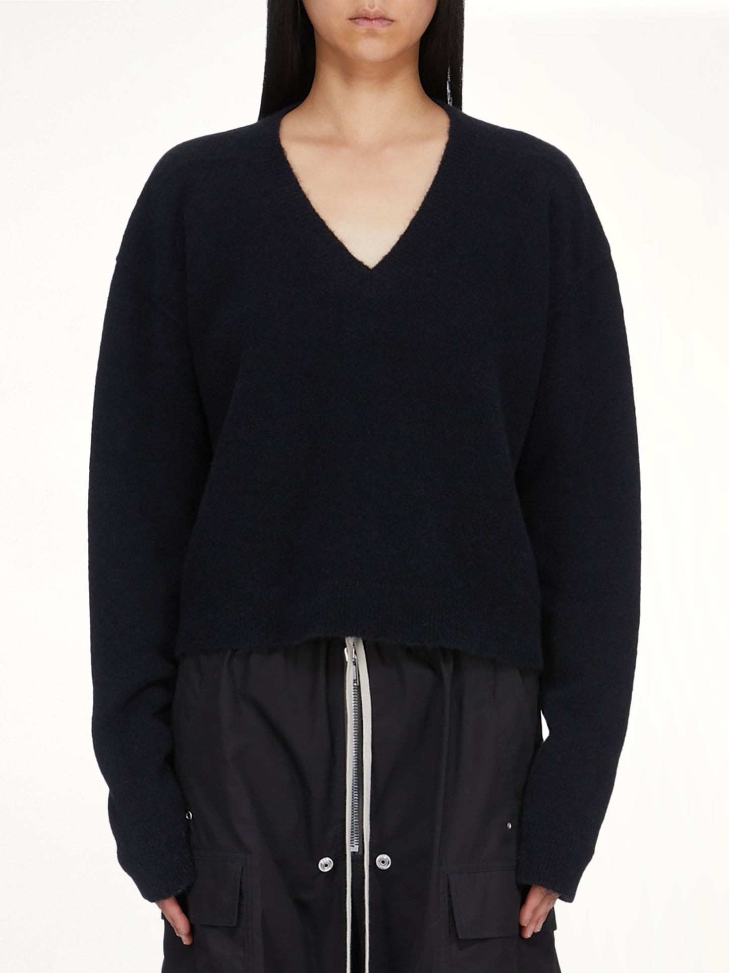 Image of a model wearing Outerwear. Product name - Tommy V Neck in Black colour by brand - RICK OWENS