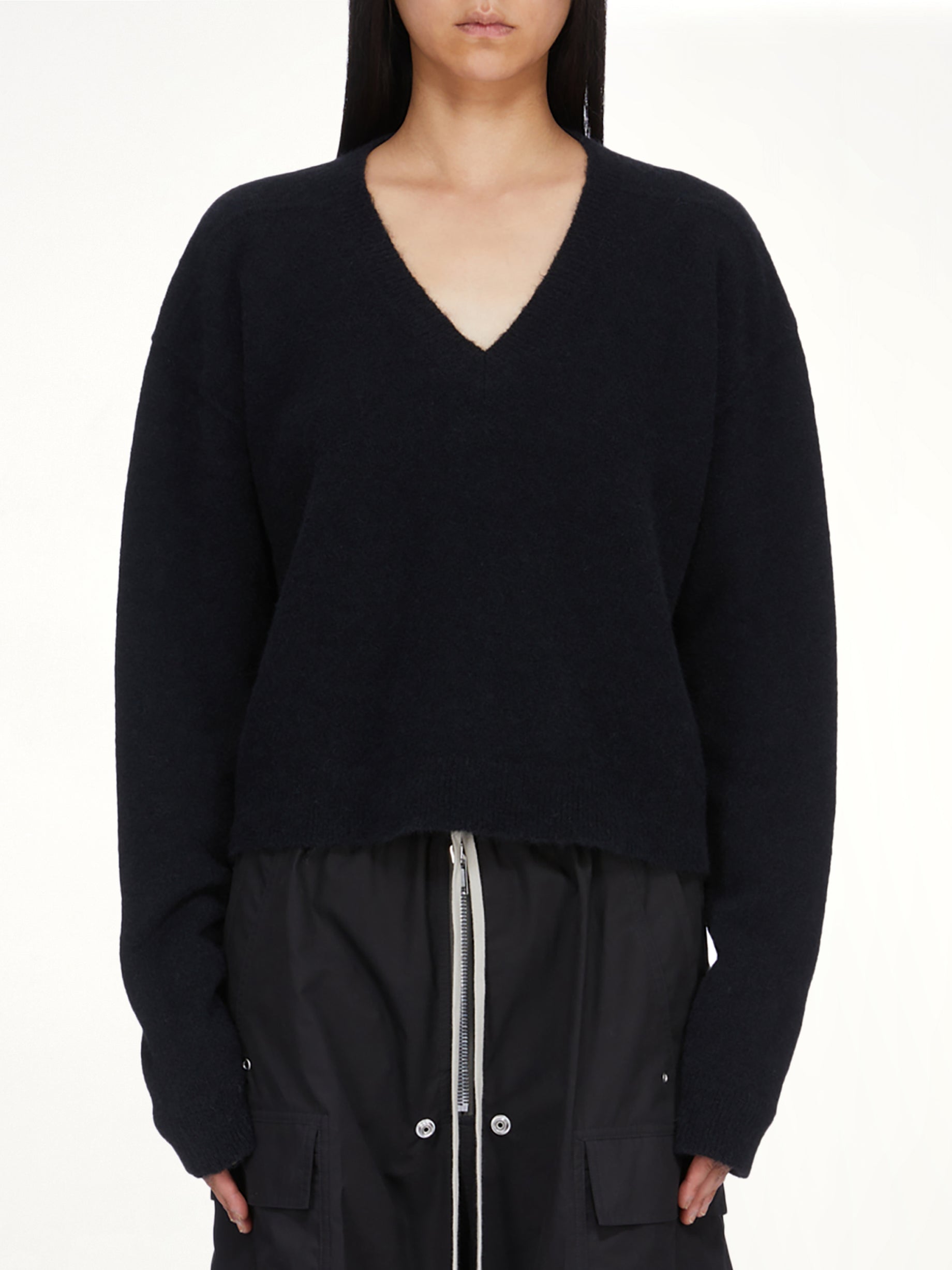 Image of a model wearing Outerwear. Product name - Tommy V Neck in Black colour by brand - RICK OWENS