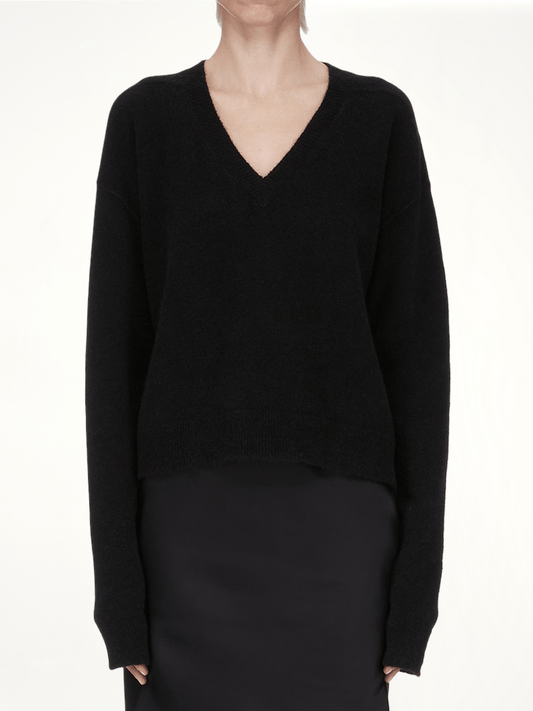 Image of a model wearing Outerwear. Productname: RICK OWENS Tommy V Neck Sweater in Black colour by brand - RICK OWENS