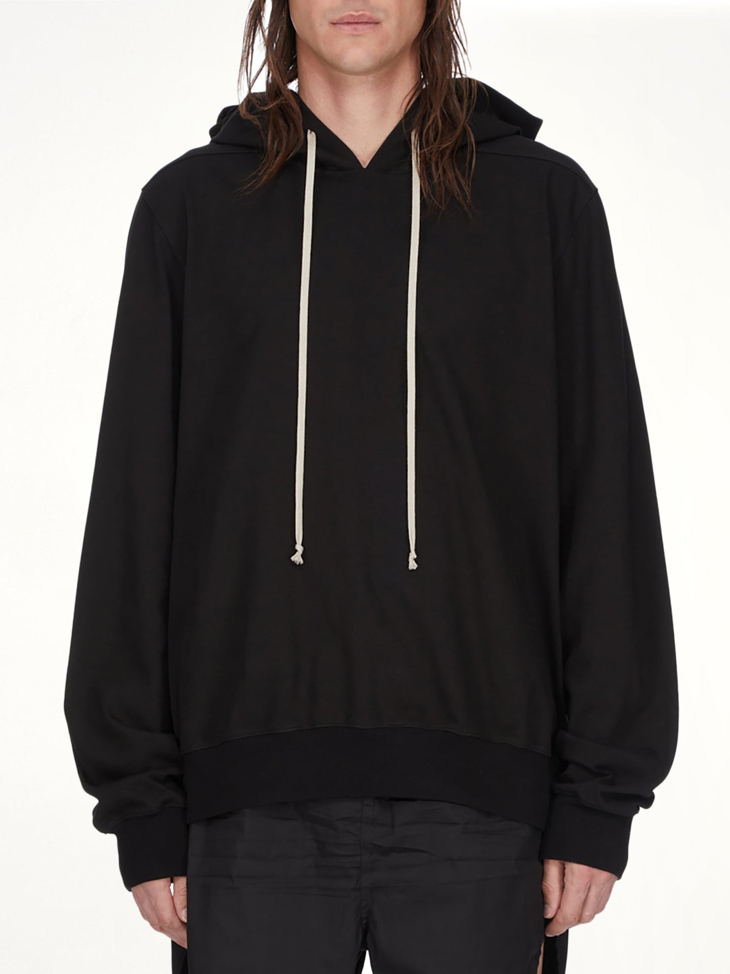Image of a model wearing Outerwear. Product name - Pullover Hoodie in Black colour by brand - RICK OWENS