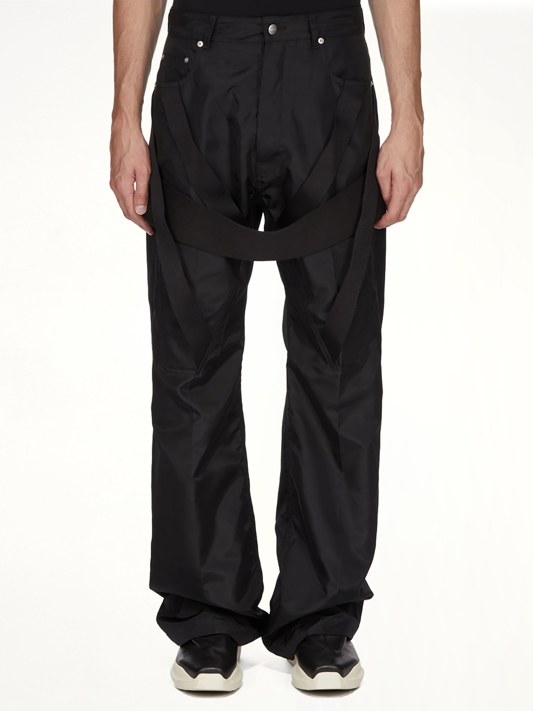 Image of a model wearing Pants. Product name - Megastrapped Geth in Black colour by brand - RICK OWENS