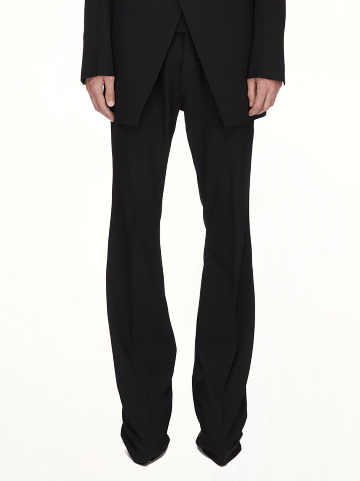 Image of a model wearing Pants. Product name - Wool Bolan Bootcut in Black colour by brand - RICK OWENS