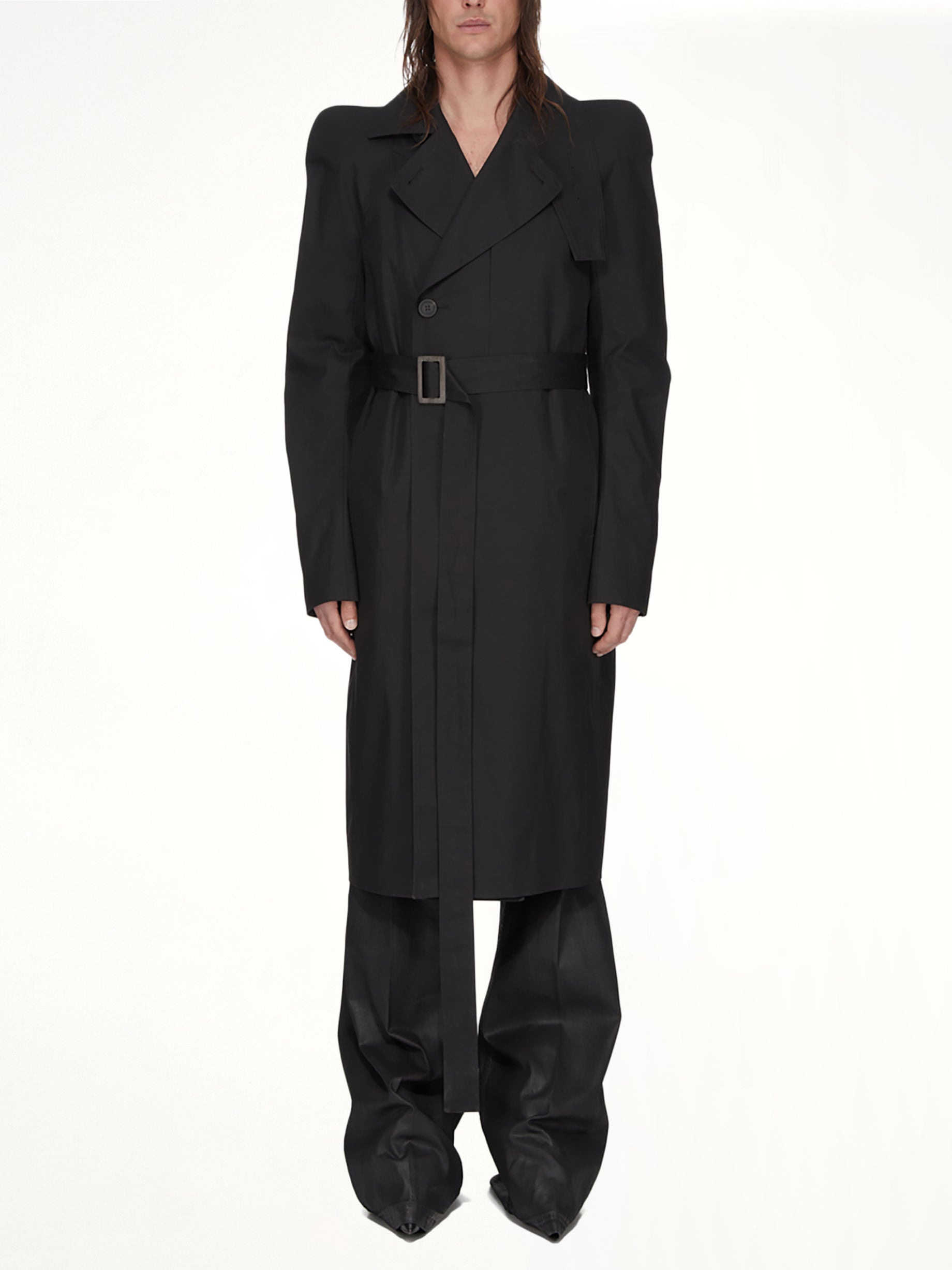 Image of a model wearing Outerwear. Product name - Temple Trench in Black colour by brand - RICK OWENS