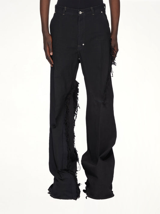 Image of a model wearing Pants. Productname: RICK OWENS Joris Trouser in Black colour by brand - RICK OWENS